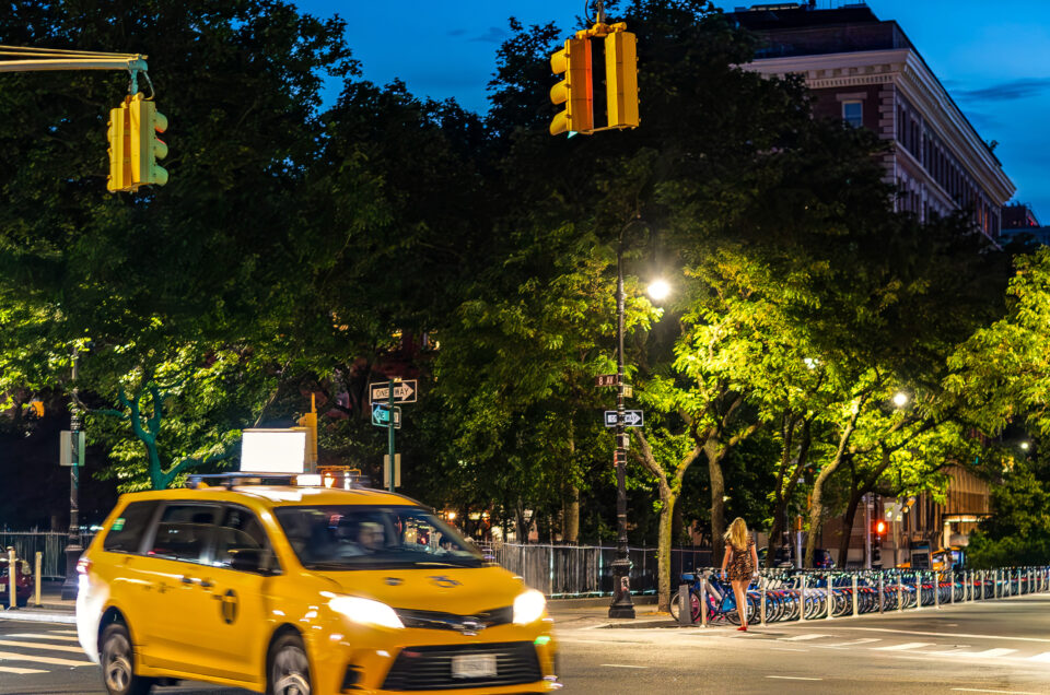 Eleven-print indigo-and-gold gallery wall featuring New York twilight photographs by Pamela Thomas-Graham.