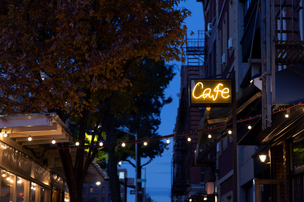 Williamsburg café glowing at twilight.