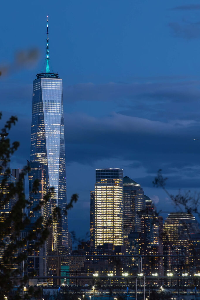 Freedom Tower reflecting golden sunset light.