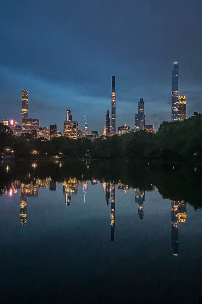 Reflections on Central Park Lake at twilight.