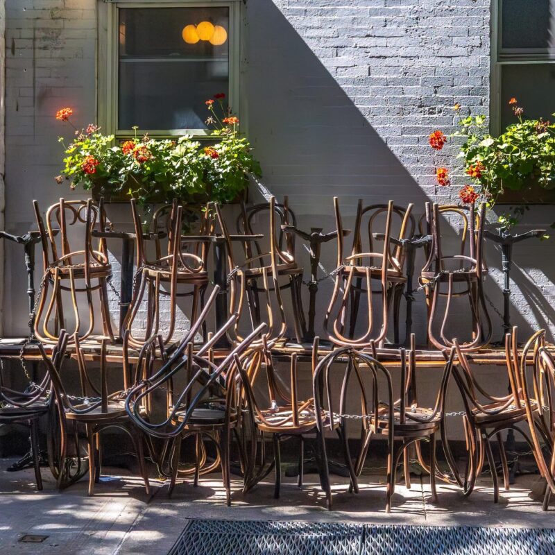 Stacked Chairs in Sunlight